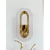 Kinkiet złoty, glamour, nowoczesny, lampa ścienna VALO w ujęciu z góry, akcentujący elegancję wnętrza. Oświetlenie na zamówienie od Primavera Home.