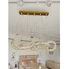 Perspektywiczne ujęcie żyrandola CRYSTAL 5 Złoty. Aranżacja nowoczesnego wnętrza od Primavera Home.
