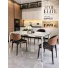Widok z boku na designerski stół glamour ze szklanym blatem, stalowy, nowoczesny, srebrny ELITE, doskonale wkomponowany w aranżację nowoczesnego wnętrza od Primavera Home.