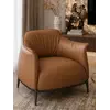 Detal stelaża Nowoczesnego wygodnego fotela luksusowego do salonu z podnóżkiem MODERN, z chromowym wykończeniem. Oświetlenie od Primavera Home.
