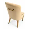Krzesło beżowe złote nowoczesne designerskie z uchwytem do jadalni NAOMI w jasnym wnętrzu, które wzbogaca przestrzeń od Primavera Home.