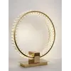 Lampa Stołowa Kryształowa Ring Złota Eclipse w nocnej atmosferze, tworzy przytulne wnętrze. Oświetlenie od Primavera Home.