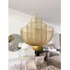 Lampa wisząca złota Florencja zestawiona w aranżacji nowoczesnego wnętrza. Oświetlenie na zamówienie od Primavera Home.