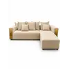 Sofa beżowa w jasnym wnętrzu, tworząca przytulną atmosferę. Detal wykończenia od Primavera Home.