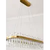 Żyrandol BULGARI L 100cm Złoty w jasnym wnętrzu. Ekspozycja w salonie od Primavera Home.