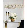 Żyrandol CRYSTAL 5 Złoty w momencie świecenia. Detal wykończenia od Primavera Home.