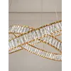 Żyrandol Kryształowy Złoty Dwupoziomowy CRYSTAL L widziany pod kątem. Detal wykończenia od Primavera Home.