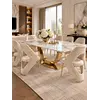 Perspektywa stołu glamour w designerskiej aranżacji, harmonijnie wpisującego się w nowoczesny design. Espozycja w salonie z Primavera Home.