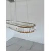 Żyrandol nowoczesny złoty Crystal w aranżacji zewnętrznej, dodający blasku przestrzeni. Oświetlenie od Primavera Home.