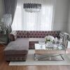 Chesterfield corner sofa with fold-out bedroom function, upholstered in glamour style