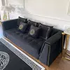 Black velvet quilted sofa, modern in a glamor style, for a golden living room MONTE CARLO
