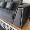 Black velvet quilted sofa, modern in a glamor style, for a golden living room MONTE CARLO