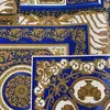 Luxurious Versace Découpage wallpaper with blue and gold squares