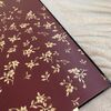 Exclusive luxury wallpaper Versace geometric shades of burgundy gold flowers