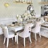Modern, golden PRINCE glamor chair with a knocker for the dining room