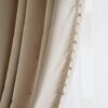 Exclusive curtain richly decorated with haberdashery