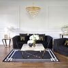 Black velvet quilted sofa, modern in a glamor style, for a golden living room MONTE CARLO