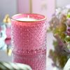 Decorative scented candle in a glass crystal container, rose gold