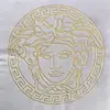 Decorative velvet pillow beige with gold logo Medusa