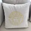 Decorative velvet pillow beige with gold logo Medusa