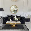 Black velvet quilted sofa, modern in a glamor style, for a golden living room MONTE CARLO