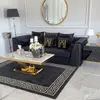 Black velvet quilted sofa, modern in a glamor style, for a golden living room MONTE CARLO