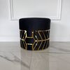 Round black and gold pouffe with DIAMOND patterns