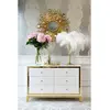 Lorenzo M Gold Glamour wooden lacquered chest of drawers with steel legs
