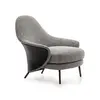 Modern, upholstered designer armchair on black legs with a LINEA footstool