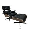 Exclusive, comfortable, modern black leather armchair with LOUNGE footstool