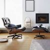 Exclusive, comfortable, modern black leather armchair with LOUNGE footstool