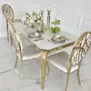 Designer dining table, glamor, with a glass top, steel, gold ELITE