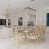 Designer dining table, glamor, with a glass top, steel, gold ELITE