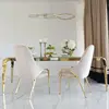 Designer dining table, glamor, with a glass top, steel, gold ELITE