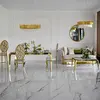 Designer dining table, glamor, with a glass top, steel, gold ELITE