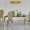 Designer dining table, glamor, with a glass top, steel, gold ELITE