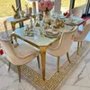 Designer dining table, glamor, with a glass top, steel, gold ELITE