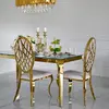Designer dining table, glamor, with a glass top, steel, gold ELITE