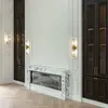 Detal wykończenia kinkietu kryształowego Roland w kolorze złotym. Projekt od Primavera Home.