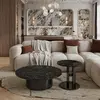 Stolik kawowy TWEEN GOLD ustawiony pod obrazem w designerskiej przestrzeni. Primavera Home.