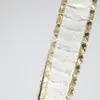 Złoty żyrandol kryształowy Crystal XS z wysokiej jakości stali nierdzewnej. Detal od Primavera Home.
