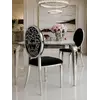 Zbliżenie na detal wykończenia ekskluzywnego krzesła, ukazujące wysoką jakość materiałów. Aranżacja nowoczesnego wnętrza od Primavera Home.