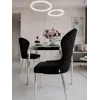 Ekskluzywne krzesło do jadalni glamour w jasnym wnętrzu, podkreślające detal wykończenia od Primavera Home.
