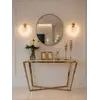 Kinkiet Kryształowy ICE ROUND widziany pod kątem, eksponujący jego unikalny design. Ekspozycja w salonie od Primavera Home.