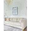 Widok na tkaninę sofy, ukazujący jej kolor i fakturę w eleganckim wnętrzu. Meble od Primavera Home.