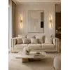 Sofa z funkcją spania w ujęciu z boku, doskonale pasująca do aranżacji nowoczesnego wnętrza. Meble na zamówienie od Primavera Home.
