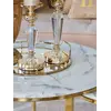 Stolik kawowy okrągły glamour, złoty, biały marmur MARCO GOLD w otoczeniu roślin. Aranżacja nowoczesnego wnętrza od Primavera Home.