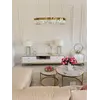Stolik kawowy okrągły glamour, złoty, biały marmur MARCO GOLD ukazany z boku. Detal wykończenia od Primavera Home.