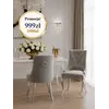 Zbliżenie na tkaninę tapicerowaną i kołatkę, ukazujące elegancję i staranność wykonania krzesła. Ekspozycja w salonie od Primavera Home.