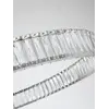 Żyrandol Kryształowy Crystal Srebrny Glamour w ciemnym wnętrzu, emanujący blaskiem. Aranżacja nowoczesnego wnętrza od Primavera Home.